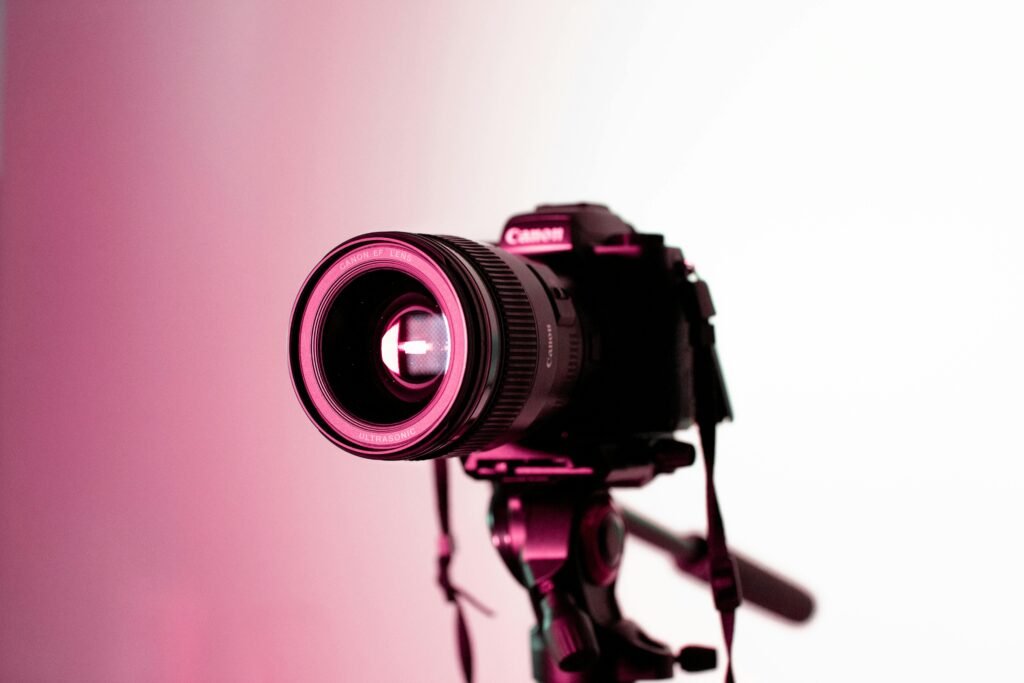 pexels-photo-1787220-1787220 Canon DSLR camera with lens on tripod in studio lighting, perfect for photography enthusiasts.