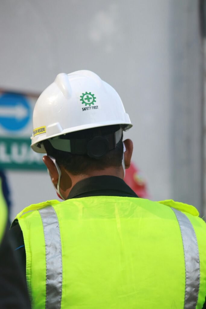 pexels-photo-8173678-8173678 Worker with safety vest and helmet at a construction site in Central Java, Indonesia.